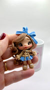 Blue Bow Clay Dolls