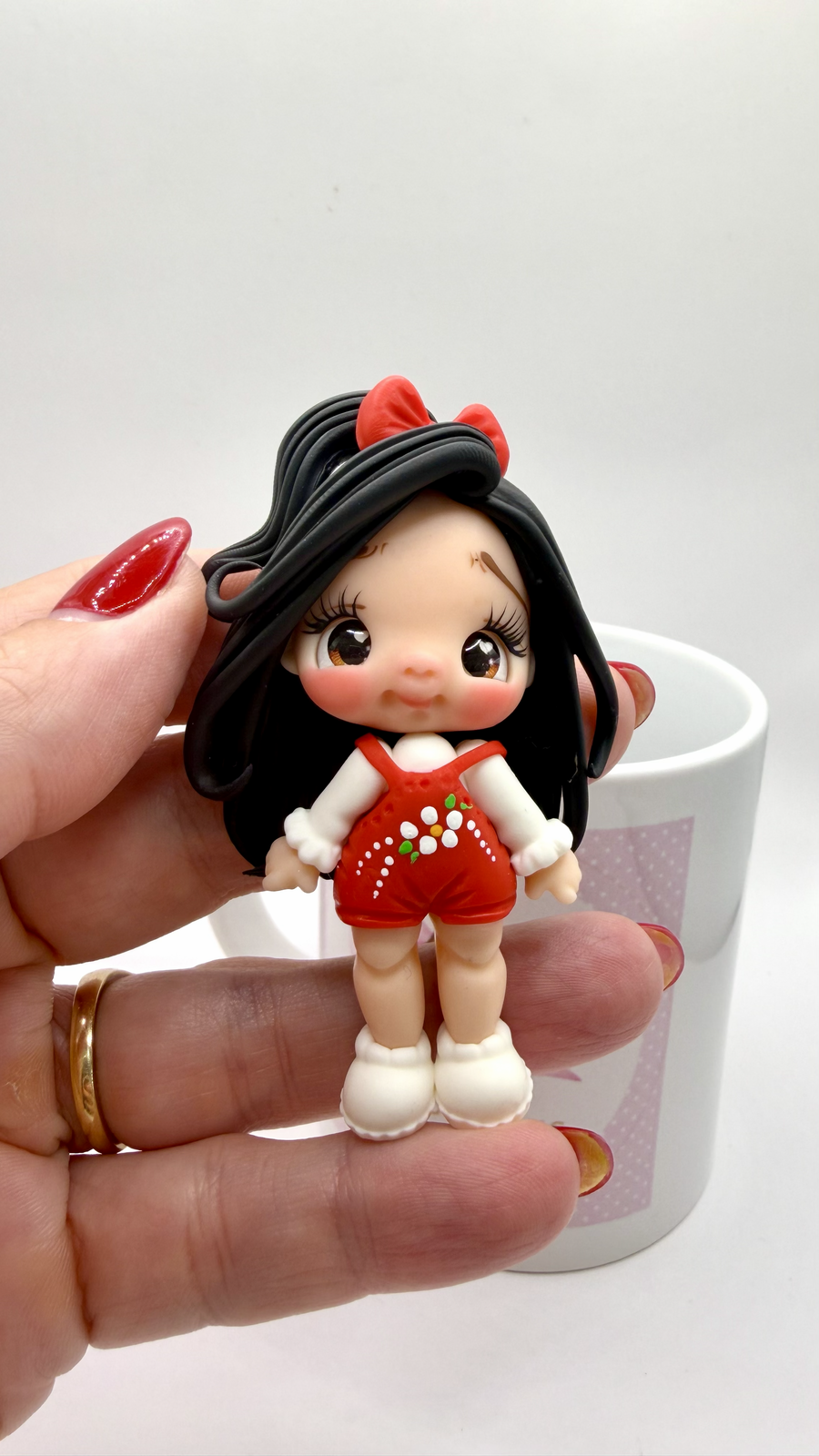 Red Girl Clay Doll