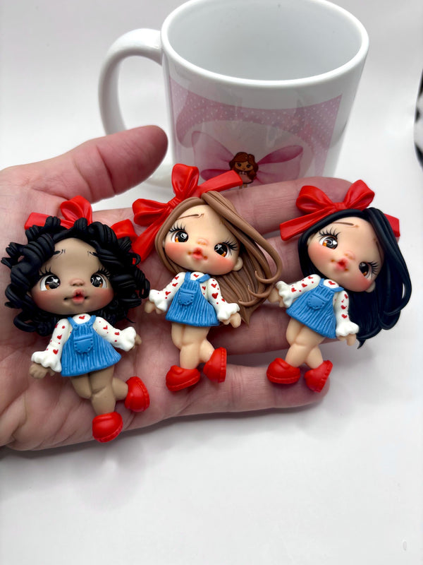 Red Ribbon Clay Doll