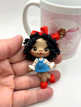 Red Ribbon Clay Doll