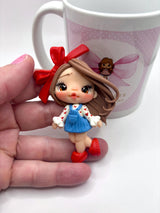 Red Ribbon Clay Doll